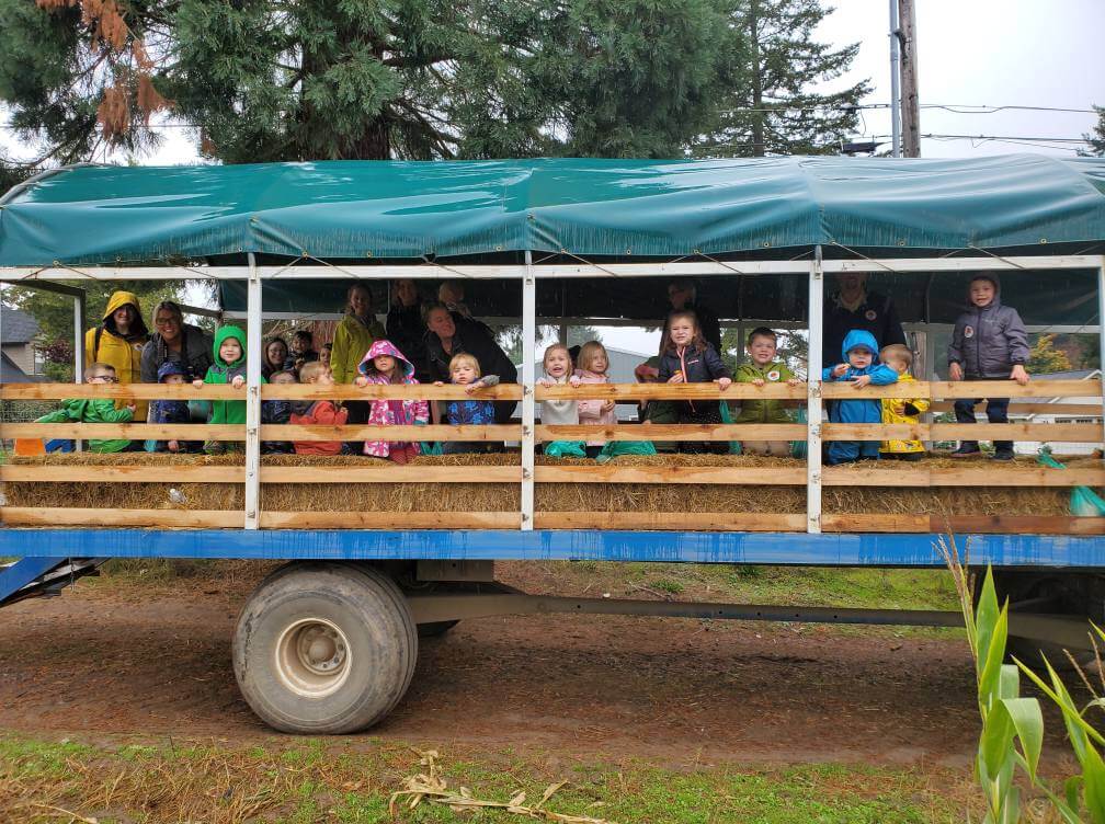 Children on a field trip on a hay ride