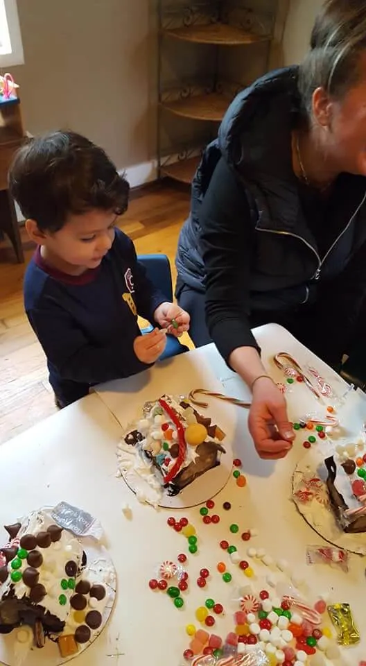 Kids making gingerbread houses